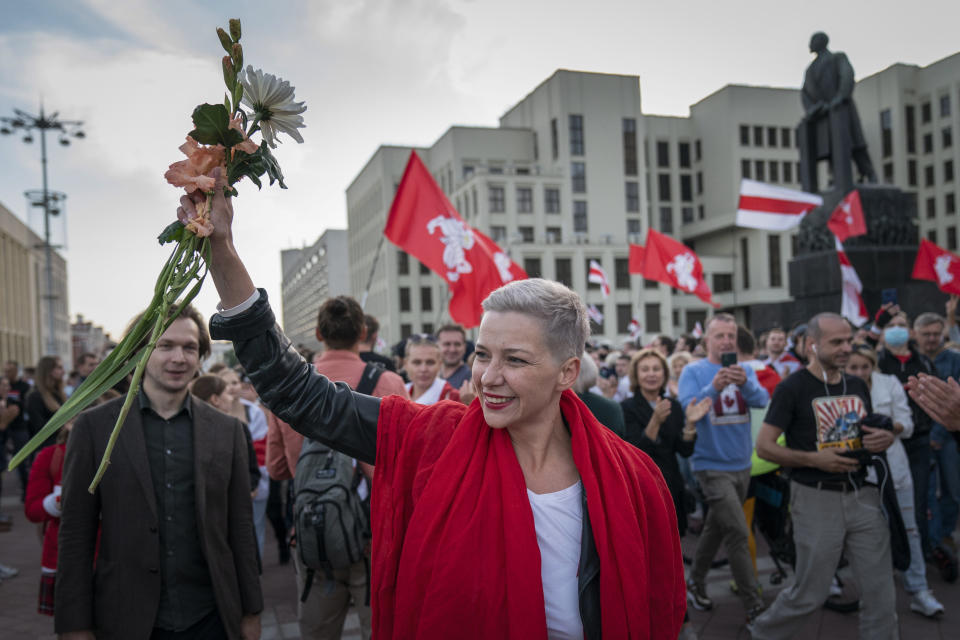 FILE – Opposition figure Maria Kolesnikova greets protesters at a rally in front of a government building in Independent Square in Minsk, Belarus, on Saturday, Aug. 22, 2020. It's been a year since Kolesnikova last wrote a letter to her family from behind bars, her father says. No one has seen or heard from Kolesnikova, who is serving 11 years in prison for organizing anti-government rallies, since Feb. 12, 2023. (AP Photo/Evgeniy Maloletka, File)