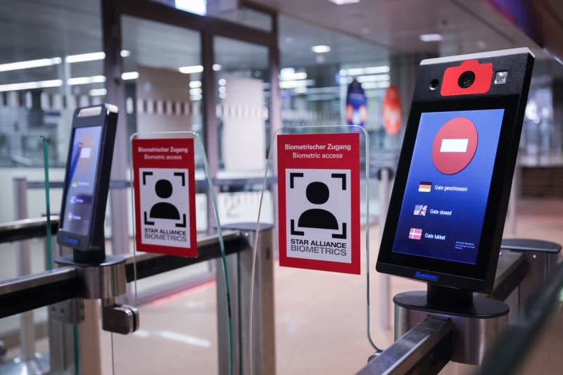 A display at the entrance to the closed and deserted security checkpoint at Hamburg Airport reads "Gate closed" in various languages, at Hamburg Airport, one of 11 major German airports that have started a one-day strike. Christian Charisius/dpa