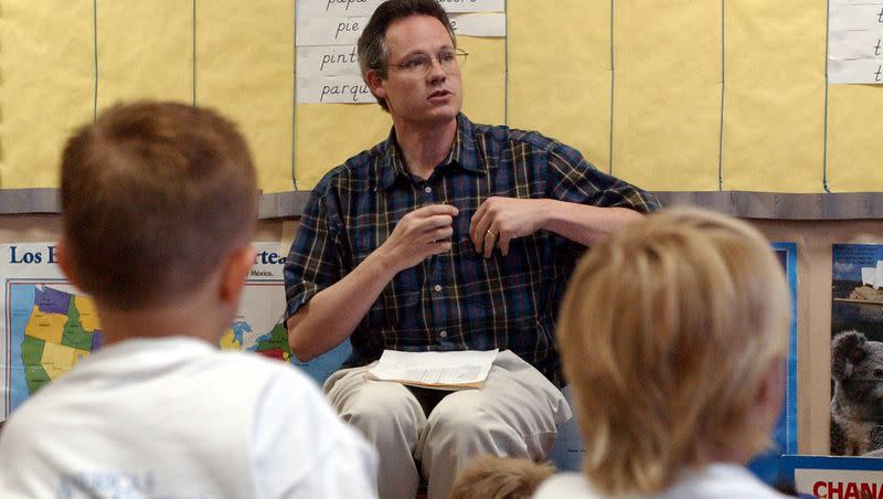 Jeff Gomm speaks with students during a summer language camp at Timpanogos Elementary in Provo on June 27, 2002.