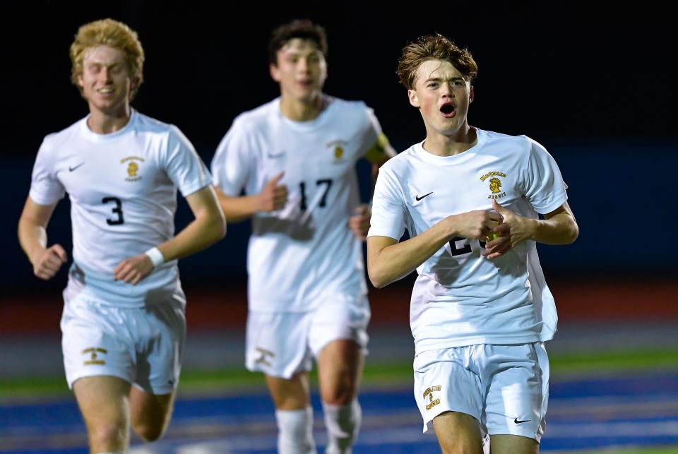 McQuaid's Trey Leo, right, celebrates after scoring against Connetquot during a Class AA semifinal at the NYSPHSAA Boys Soccer Championships in Middletown, N.Y., Saturday, Nov. 12, 2022. McQuaid advanced to the Class AA final with a 3-0 win over Connetquot-XI.