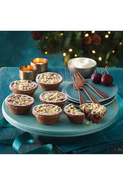 <p><strong>Overall Score: 76/100 </strong></p><p>These alternative mince pies have chocolate pastry cases with a crumble topping sprinkled with chocolate drops and dusted with icing sugar and gold glitter. There is a generous filling of glossy cherries and vine fruit and the aroma is sweet and rich with lots of vanilla, a hint of cocoa and a tangy-sweet red cherry compote note. Testers loved the balance of dark chocolate and cherry-flavoured mincemeat flavours with a hint of festive spice.</p><p><a class="link " href="https://go.redirectingat.com?id=127X1599956&url=https%3A%2F%2Fgroceries.morrisons.com%2Fproducts%2Fmorrisons-the-best-black-forest-mince-pie-crumbles-427210011&sref=https%3A%2F%2Fwww.goodhousekeeping.com%2Fuk%2Ffood%2Ffood-reviews%2Fg29140204%2Falternative-mince-pies%2F" rel="nofollow noopener" target="_blank" data-ylk="slk:BUY NOW;elm:context_link;itc:0;sec:content-canvas">BUY NOW</a><strong> Morrisons, £2 for 6</strong></p>