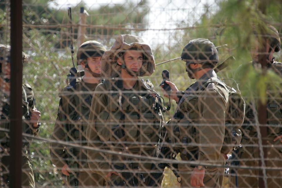 Israeli soldiers patrol the border with Lebanon near Kfarkila village in south Lebanon Oct. 28, 2009. Lebanese army soldiers found and deactivated four rockets on Wednesday in the area from where a rocket had been fired towards northern Israel, witnesses said.  