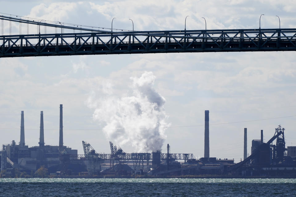 Zug Island, a heavily industrialized island at the southern city limits of Detroit is seen, Friday, Oct. 16, 2020, in Detroit. The area in Southwest Detroit has been the subject of numerous air pollution and public health studies. The area has a refinery, a coal-fired power plant, steel mills and other industrial sites. (AP Photo/Carlos Osorio)