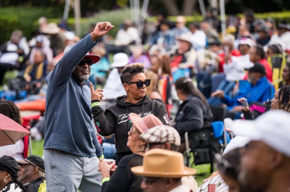 Maria Dominguez points to dance partner Rod Gaulman, both of the Sacramento region, while the two move to the sounds of Robin Duhe and his band during the inaugural Elk Grove Fall Jazz Festival on Saturday at the Laguna Town Hall amphitheater.