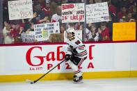 Chicago Blackhawks center Connor Bedard (98) warms up for the team's NHL hockey game against the Ottawa Senators, as fans hold signs Thursday, March 28, 2024, in Ottawa, Ontario. (Sean Kilpatrick/The Canadian Press via AP)