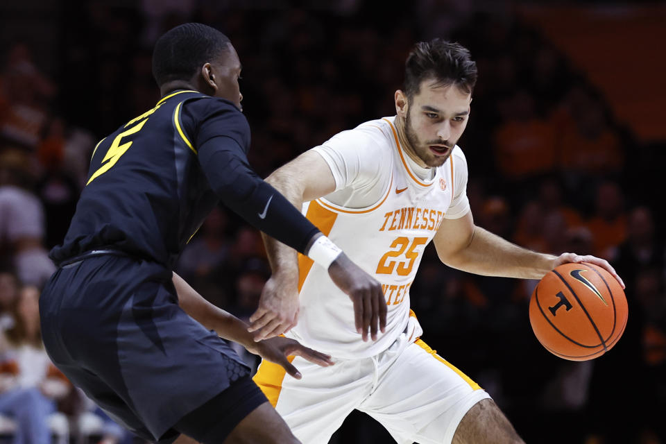 Tennessee guard Santiago Vescovi (25) drives as he is defended by Missouri guard D'Moi Hodge (5) during the first half of an NCAA college basketball game Saturday, Feb. 11, 2023, in Knoxville, Tenn. (AP Photo/Wade Payne)