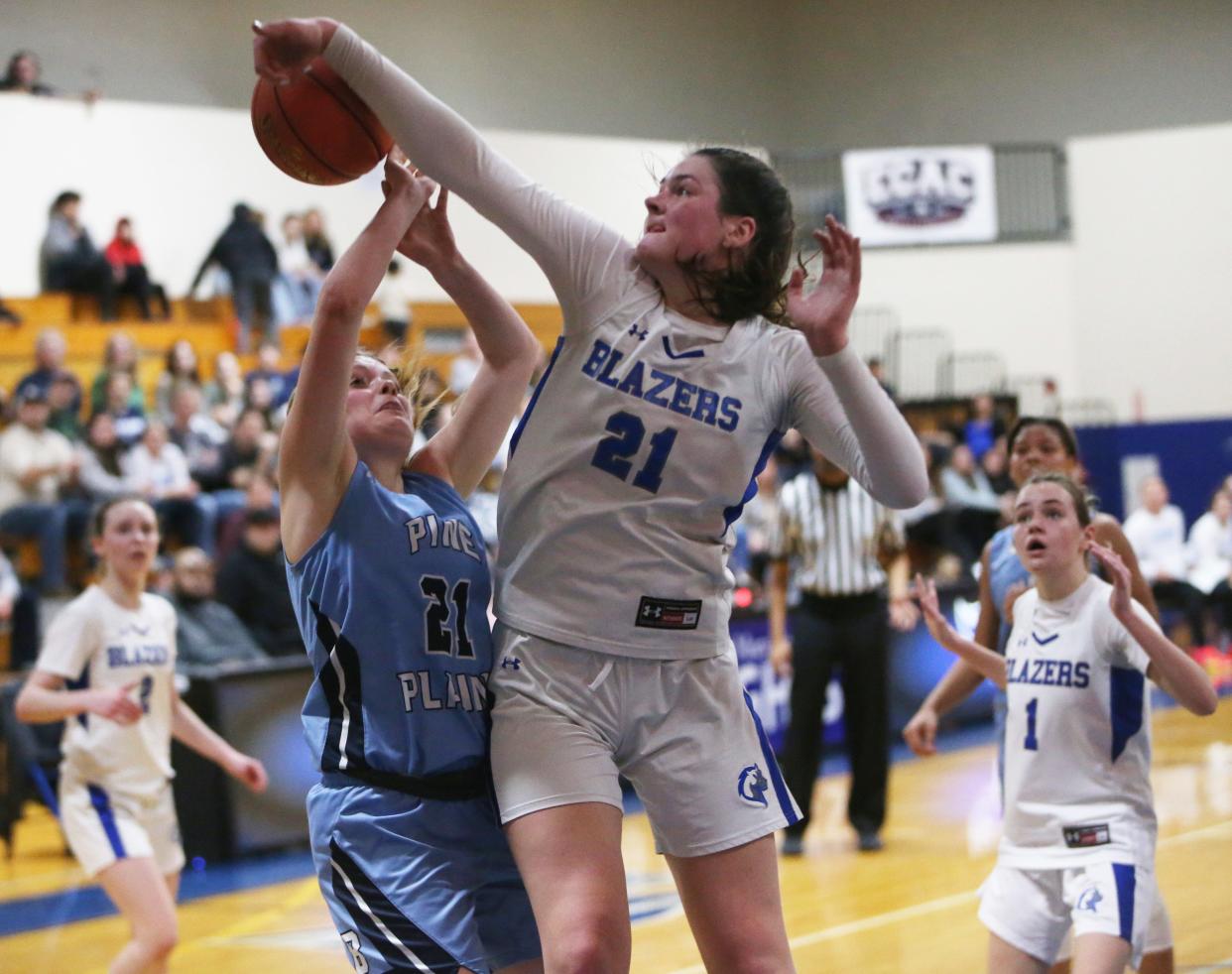 Millbrook's Natalie Fox blocks a shot from Pine Plains' Elizabeth Hieter during the Section 9 Class C girls basketball championship on February 28, 2024.