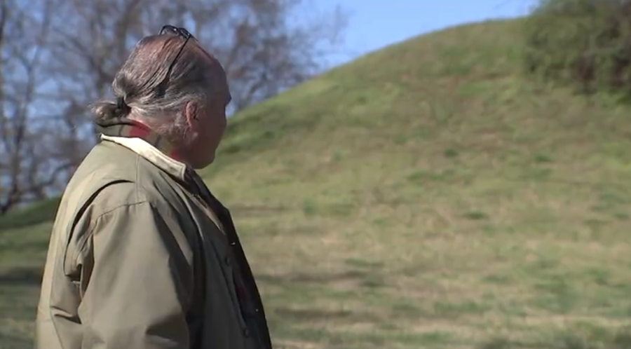 Tom Kunesh looks on at one of the mounds at the Boiling Spring Site in Brentwood. (WKRN photo)