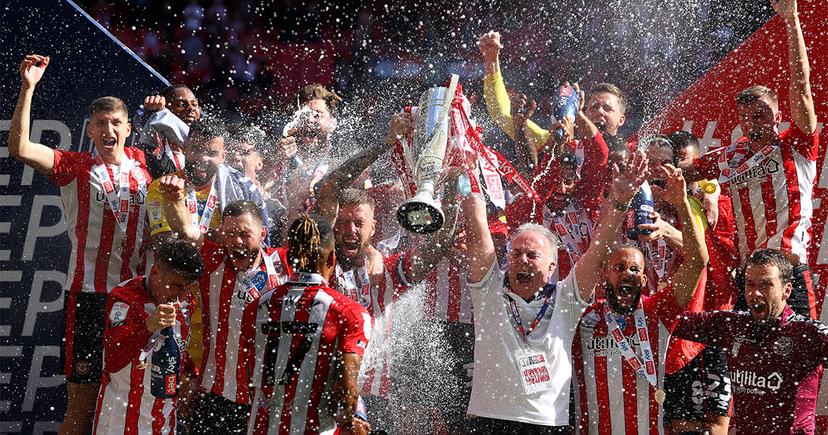  Pontus Jansson of Brentford lifts the Sky Bet Championship Play-off Final trophy in celebration with team mates after victory in the Sky Bet Championship Play-off Final between Brentford FC and Swansea City at Wembley Stadium on May 29, 2021 in London, England. 