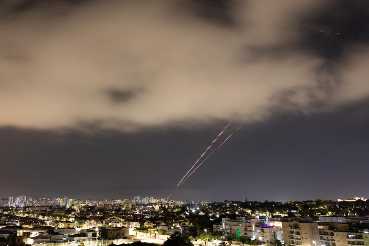 Objects are intercepted in the sky after Iran launched drones and missiles toward Israel, as seen from Ashkelon, Israel April 14, 2024. (Amir Cohen/Reuters - image credit)