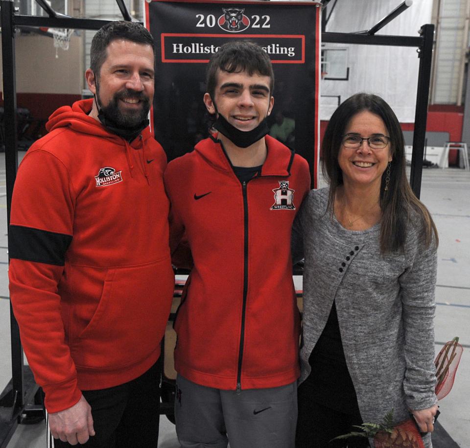 The Holliston High School wrestling team defeated Bellingham 47-30, on Senior Night, Jan. 26, 2022. Senior captain Matt Amante (center) was honored before the match, here with dad Greg Amante and mom Jessica Hughes. Amante is the lone senior on Holliston.
