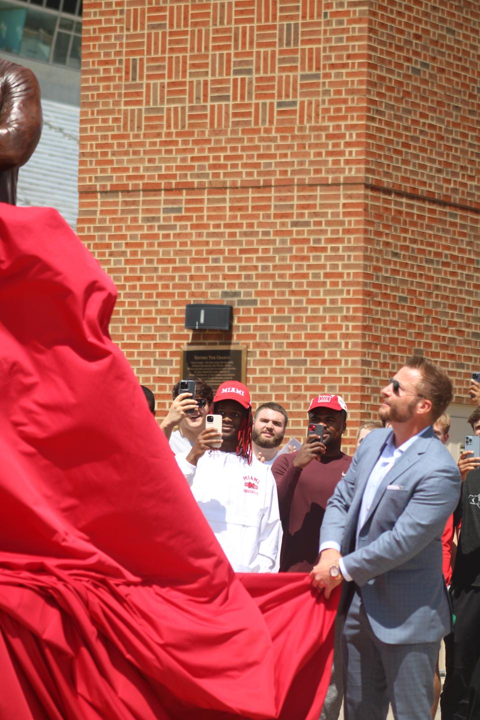 Sean McVay pulls off the tarp to unveil his statue. Los Angeles Rams head football coach Sean McVay became the 10th coach to have a statue in Miami University's prestigious Cradle of Coaches Plaza May 6, 2023. McVay was a former player at Miami and has been coaching in the NFL since 2009.  He became the youngest head coach in NFL history to win a Super Bowl (36) when the Rams beat the Bengals in 2022.