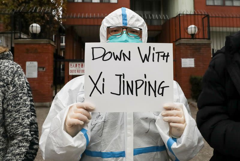 People protest in solidarity over COVID-19 restrictions in mainland China, in Toronto