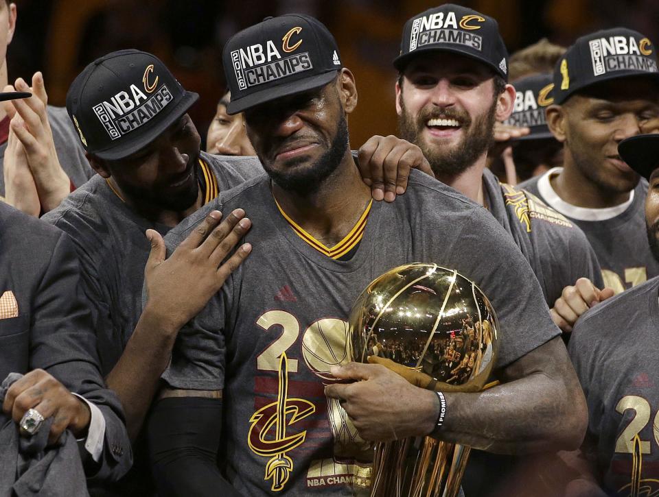 Cavaliers forward LeBron James, center, celebrates with teammates after Game 7 of basketball's NBA Finals against the Golden State Warriors on June 19, 2016.