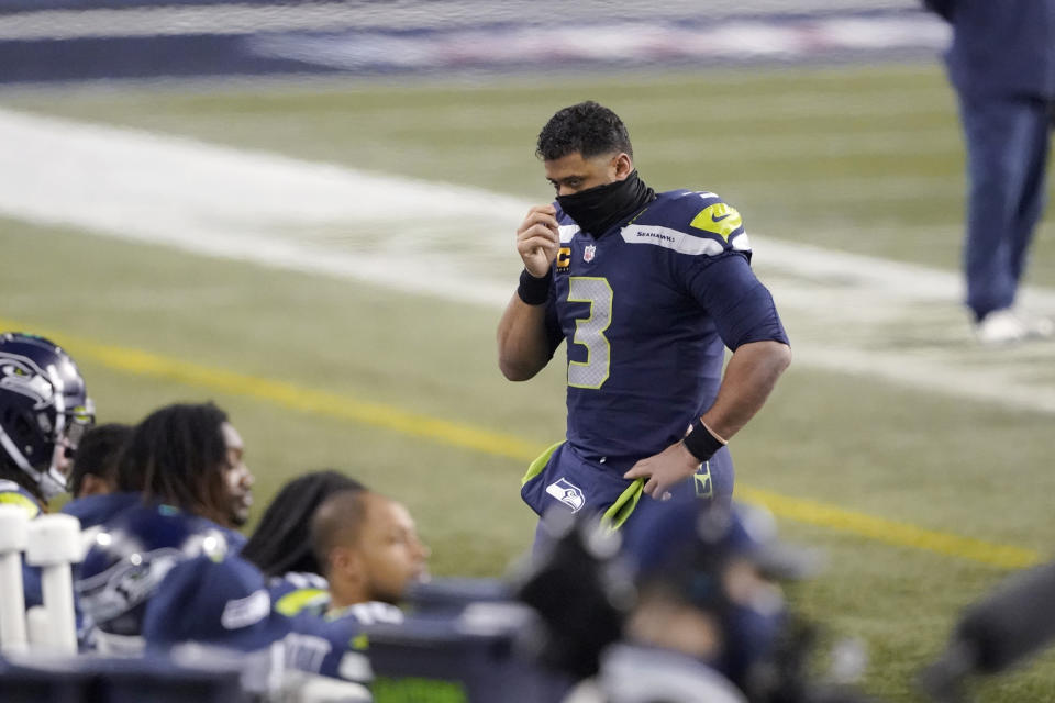 Seattle Seahawks quarterback Russell Wilson (3) looks toward his bench near the end of the second half of an NFL wild-card playoff football game against the Los Angeles Rams, Saturday, Jan. 9, 2021, in Seattle. (AP Photo/Ted S. Warren)