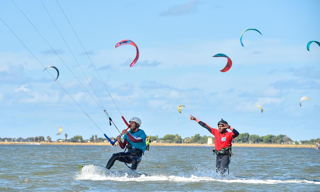 <span>An instructor helps a kitesurfer perfect his water start on the Stagnone Lagoon, Sicily.</span><span>Photograph: Ski Press</span>