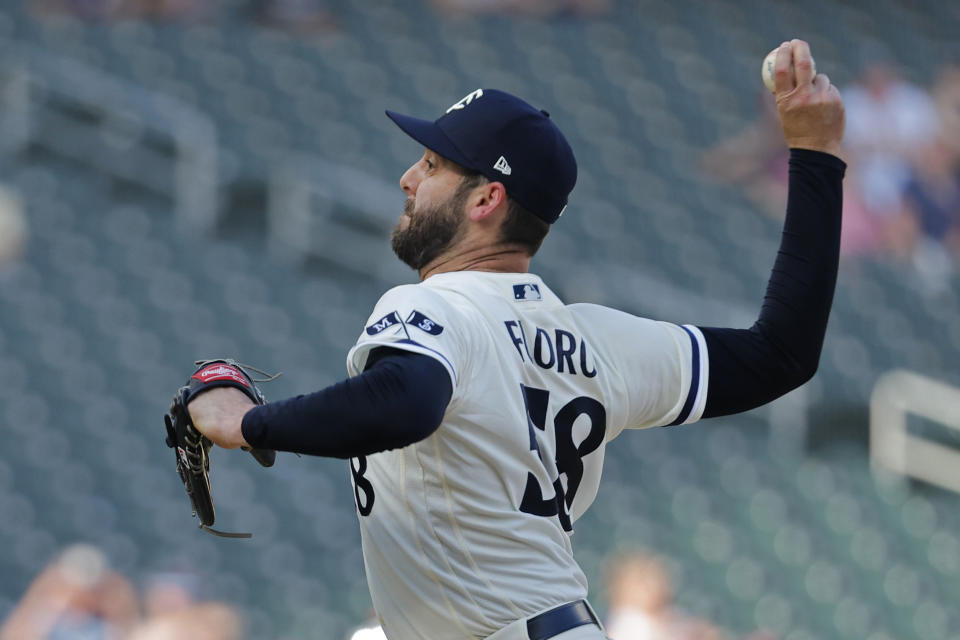 Minnesota Twins relief pitcher Dylan Floro throws to the Texas Rangers in the 13th inning of a baseball game Sunday, Aug. 27, 2023, in Minneapolis. The Twins won 7-6 in extra innings. (AP Photo/Bruce Kluckhohn)