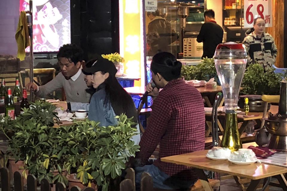 In this Dec. 6, 2019 photo, Wu Yi, who has struggled with Oxycontin abuse, sings a song for customers at an all-night restaurant in Shenzhen in southern China's Guangdong Province. Officially, pain pill abuse is an American problem, not a Chinese one. But people in China have fallen into opioid abuse the same way many Americans did, through a doctor's prescription. And despite China's strict regulations, online trafficking networks, which facilitated the spread of opioids in the U.S., also exist in China. (AP Photo/Mark Schiefelbein)