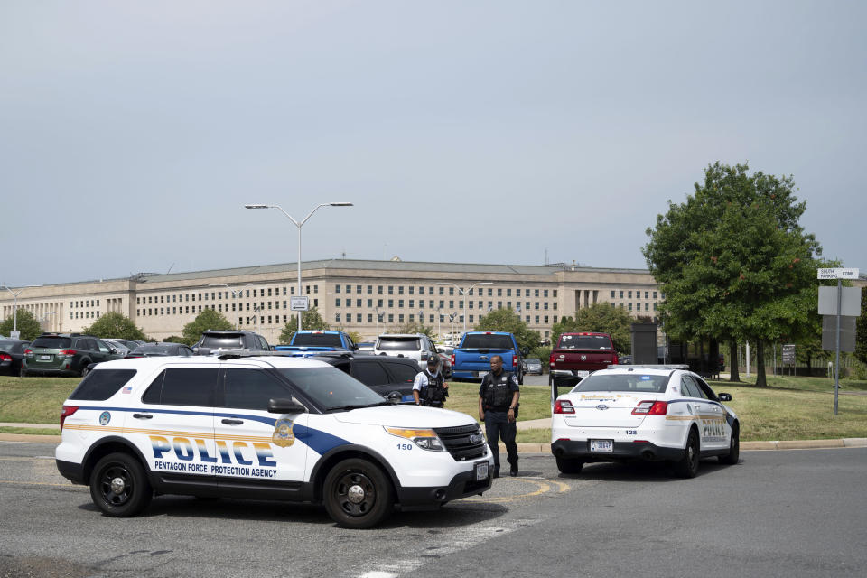 Police block off an entrance to the Pentagon following reports of multiple gun shots fired on a bus platform near the facility. Source: AP