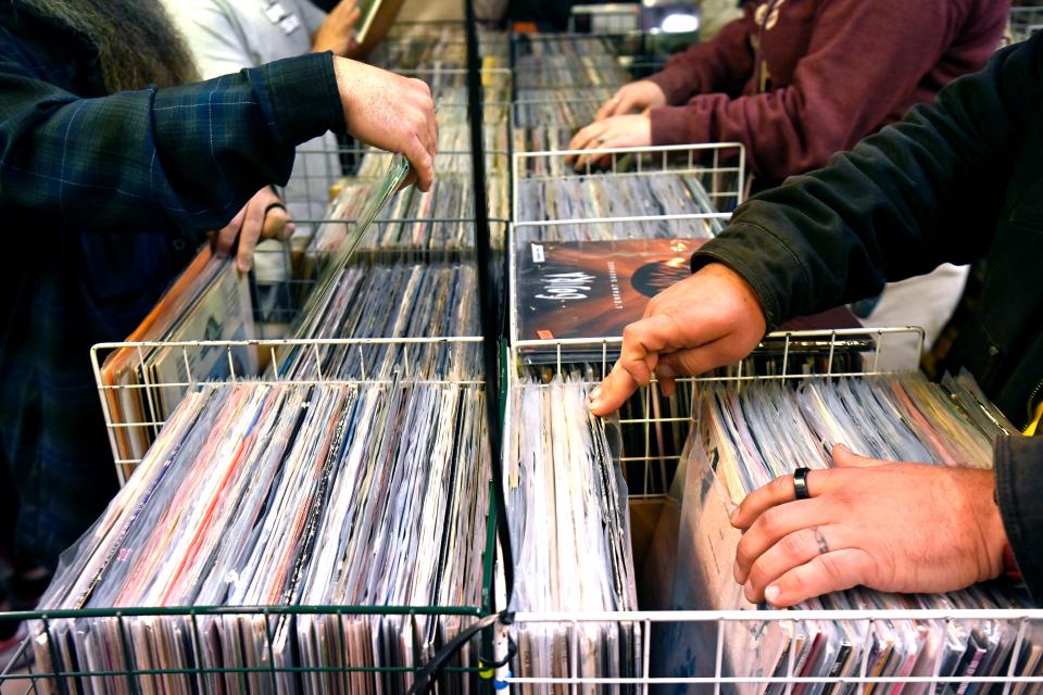 Vinyl aficionados flip through the displays at The Record Guys during Record Store Day Saturday.