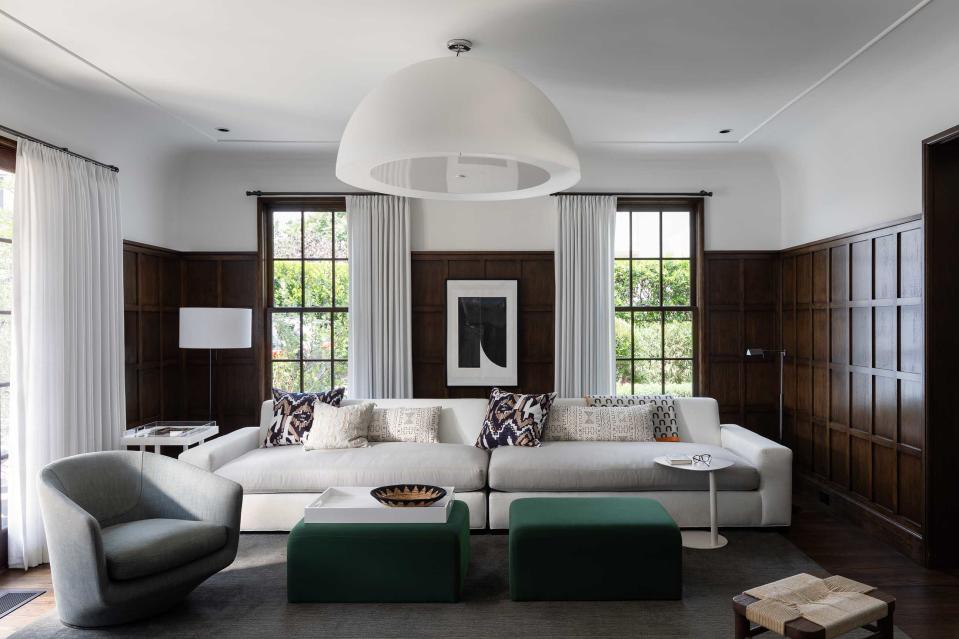 white living room with dark wooden shaker paneling