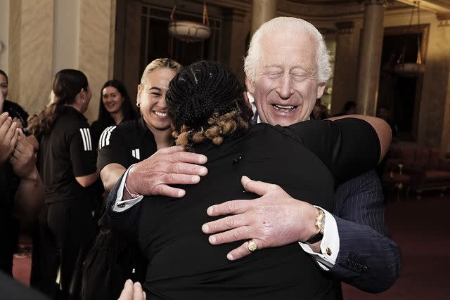 <p>Aaron Chown - WPA Pool/Getty</p> One of the New Zealand Black Ferns team also got a solo hug from King Charles at Buckingham Palace on Sept 11, 2024