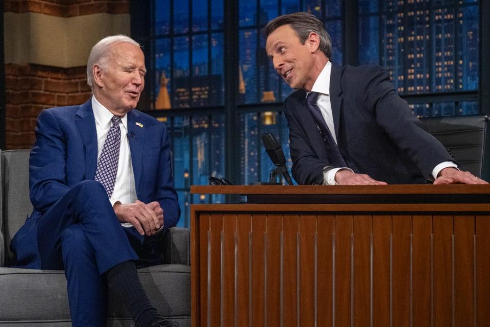 US President Joe Biden speaks with host Seth Meyers during a taping of 