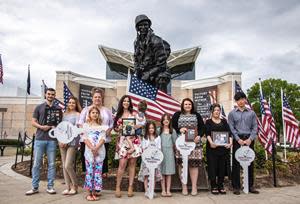 The family of Army Sergeant 1st Class Keith Callahan, Army Staff Sergeant Jacob Hess,  Army Chief Warrant Officer 3 Christopher Allgaier, and Army Staff Sergeant Kyu Chay receive mortgage-payoff notices from the Tunnel to Towers Foundation.