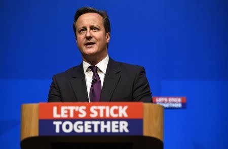 Britain's Prime Minister David Cameron delivers a speech at the Aberdeen Exhibition and Conference Centre in Aberdeen, Scotland, in this September 15, 2014 file photo. REUTERS/Dylan Martinez/Files