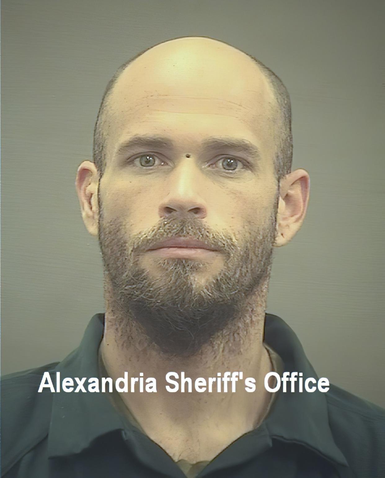 This image provided by The Alexandria (Va.) Sheriff's Office shows Jacob Chansley. A judge ordered corrections authorities to provide organic food to the Arizona man who is accused of participating in the insurrection at the U.S. Capitol while sporting face paint, no shirt and a furry hat with horns. He was moved from the Washington jail to the Virginia facility. 