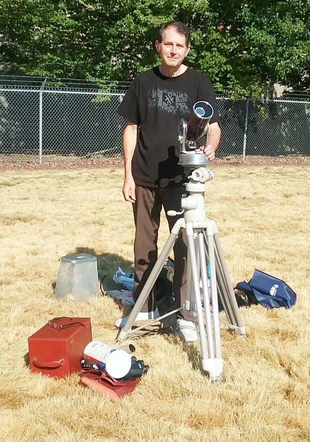 Chris Keller is setting up equipment to view the April 21, 2017, solar eclipse in Oregon. Chris noted that he still uses the 3.5-inch Questar catadioptric telescope his father gave when he was in eighth grade.