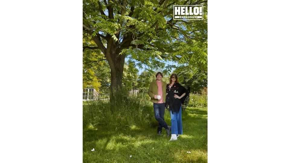 Blur star Alex James and wife Claire posing in grounds of farmhouse in Kingham, Oxfordshire 