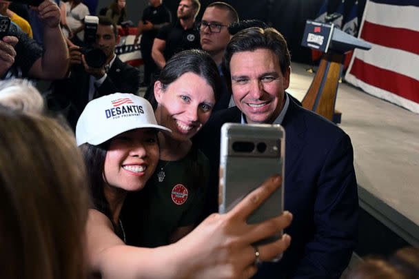 PHOTO: Florida Governor and 2024 Presidential hopeful Ron DeSantis poses for photos with supporters after speaking during his campaign kickoff event at Eternity Church, in Clive, Iowa, on May 30, 2023. (Andrew Caballero-Reynolds/AFP via Getty Images)