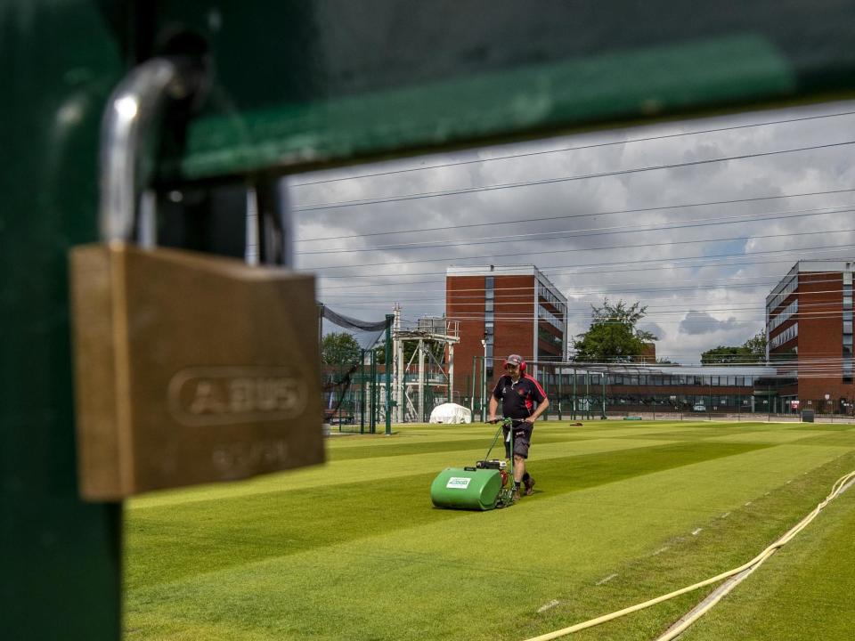 Groundsman Colin Bury works on the practice pitches at Emirates Old Trafford: PA