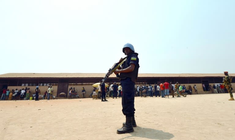 A United Nations peacekeepers stands guard outside a polling station in Bangui as people go to the polls on February 14, 2016