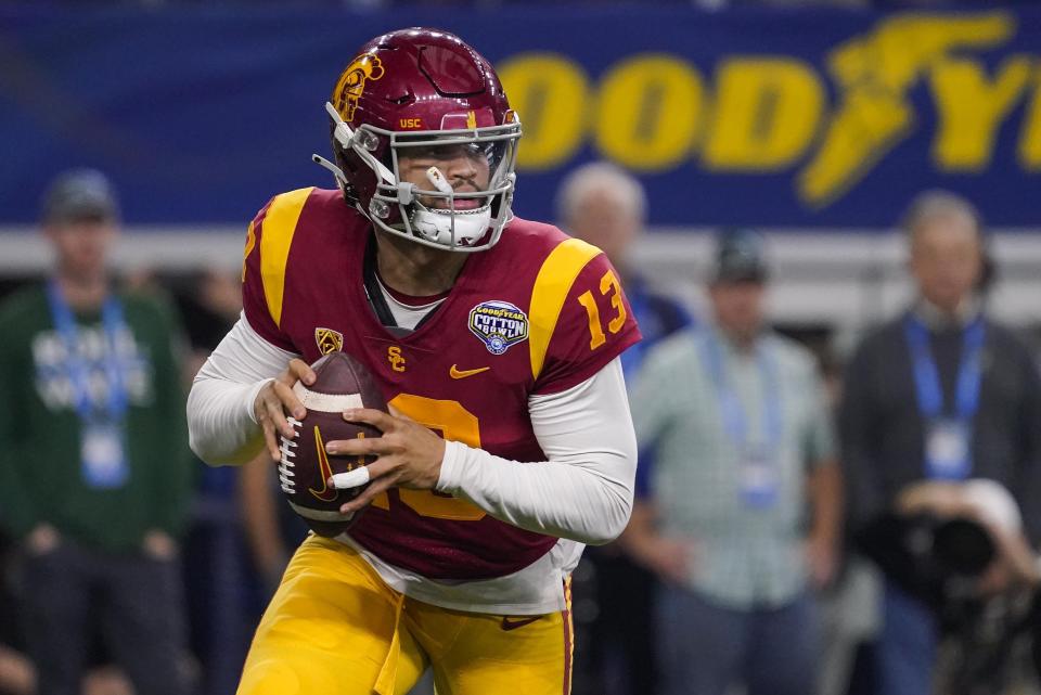 FILE - Southern California quarterback Caleb Williams (13) looks to pass during the first half of the Cotton Bowl NCAA college football game against Tulane, Monday, Jan. 2, 2023, in Arlington, Texas. USC came within one game of reaching the College Football Playoff last season. (AP Photo/Sam Hodde, File)