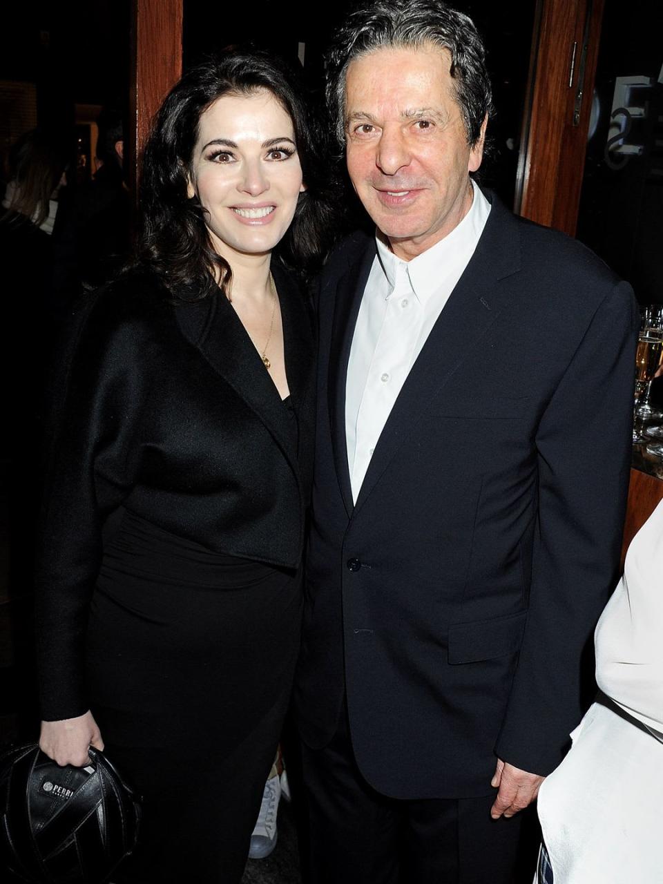 Nigella Lawson in a black dress with her ex-husband Charles Saatchi