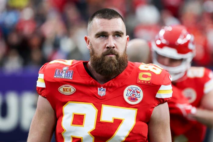 Kansas City Chiefs player in uniform with number 87 and a captain's patch on the field