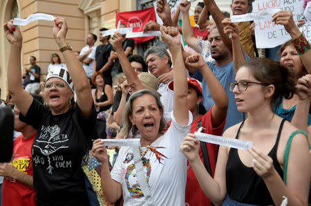 Demonstrators hold papers with names of the victims of Brazilian mining company Vale SA collapse during a protest in Belo Horizonte, Brazil January 31, 2019. REUTERS/Washington Alves