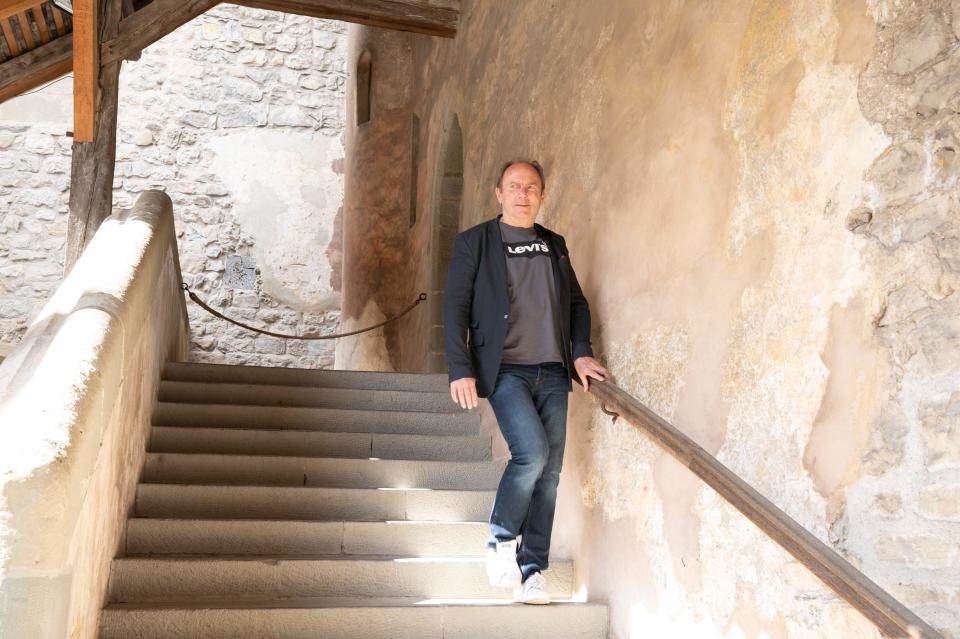 A device implanted in his lower back helps Parkinson's patient Marc Gauthier negotiate stairs.