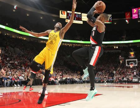 Feb 13, 2019; Portland, OR, USA; Portland Trail Blazers guard Damian Lillard (0) shoots over Golden State Warriors forward Kevin Durant (35) in the second half at Moda Center. Jaime Valdez-USA TODAY Sports