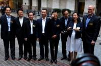 Alibaba Group Holding Ltd founder Jack Ma (5th L) arrives at the New York Stock Exchange for his company's initial public offering (IPO) under the ticker "BABA" in New York September 19, 2014. REUTERS/Lucas Jackson