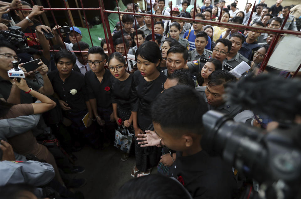 Members of Student Union and leaders of Peacock Generation "Thangyat" Performance Group, from left; Zayar Lwin, Paing Phyo Min, Su Yadana Myint, and Kay Khine Tun, stand as they leave a township court after their trial Wednesday, Oct. 30, 2019, in Yangon, Myanmar. Five members of the Student Union received a year of hard labor after a satirical production against the military in April. (AP Photo/Thein Zaw)