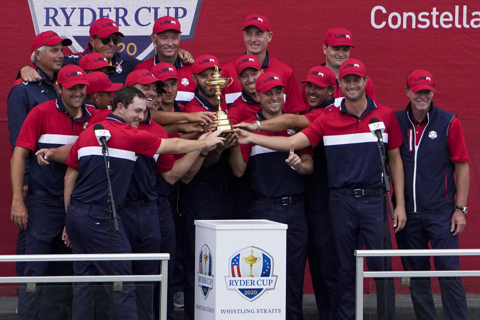 Team USA poses with the trophy at the closing ceremony after the Ryder Cup matches at the Whistling Straits Golf Course Sunday, Sept. 26, 2021, in Sheboygan, Wis. (AP Photo/Jeff Roberson)