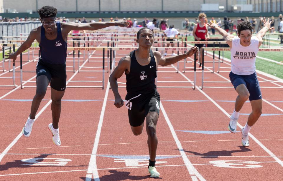 Lakewood Menzel Thomas takes first in the 110 hurdles and CBA's Kam Coleman (left) is second at the Shore Conference Outdoor Track and Field Championships in Neptune, NJ on May 21, 2022.