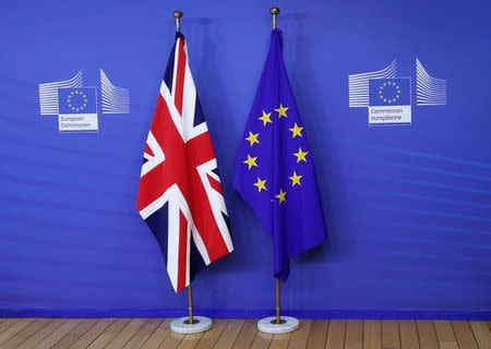 Flags are seen at the EU Commission headquarters ahead of a first full round of talks on Brexit, Britain's divorce terms from the European Union, in Brussels, Belgium July 17, 2017. REUTERS/Yves Herman