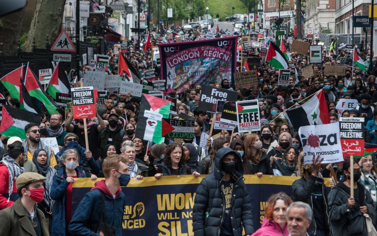 Thousands of people join a protest march to the Israeli Embassy  - Getty