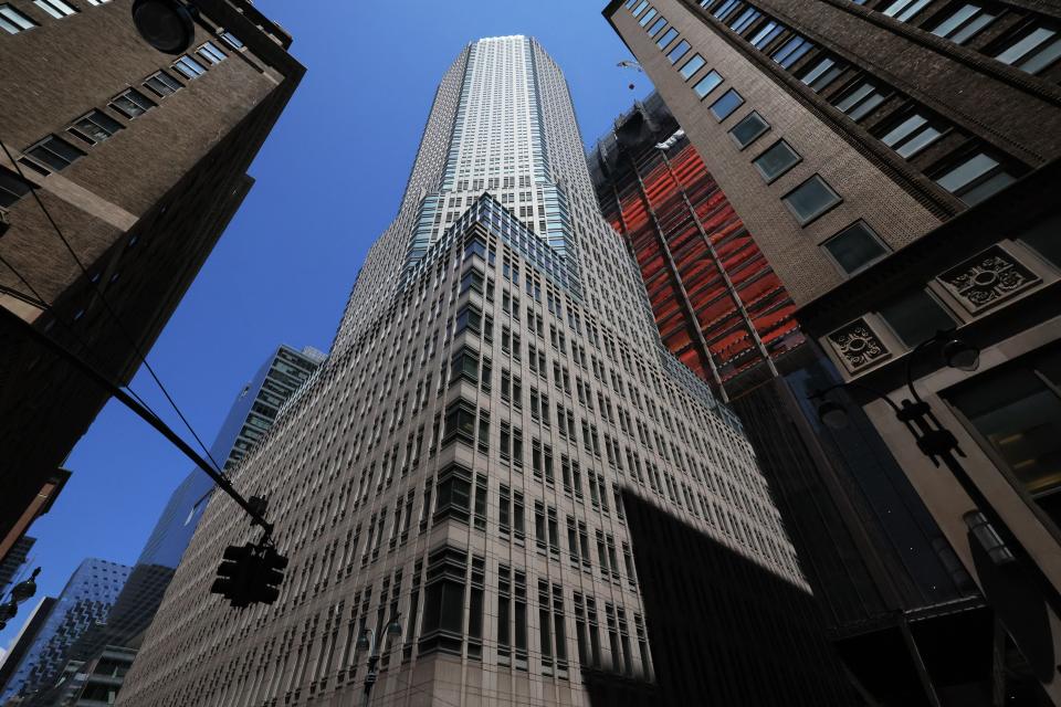 An office tower is seen from the ground.