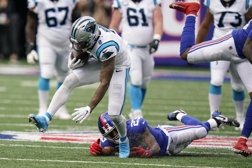 Carolina Panthers wide receiver D.J. Moore (2) breaks a tackle by New York Giants' Logan Ryan (23) during the first half of an NFL football game, Sunday, Oct. 24, 2021, in East Rutherford, N.J. (AP Photo/Seth Wenig)