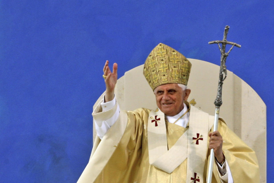 FILE - Pope Benedict XVI waves to pilgrims at the end of a papal Mass at the Islinger field in Regensburg, southern Germany, on Sept. 12, 2006. Pope Emeritus Benedict XVI, the German theologian who will be remembered as the first pope in 600 years to resign, has died, the Vatican announced Saturday. He was 95. (AP Photo/Markus Schreiber, File)